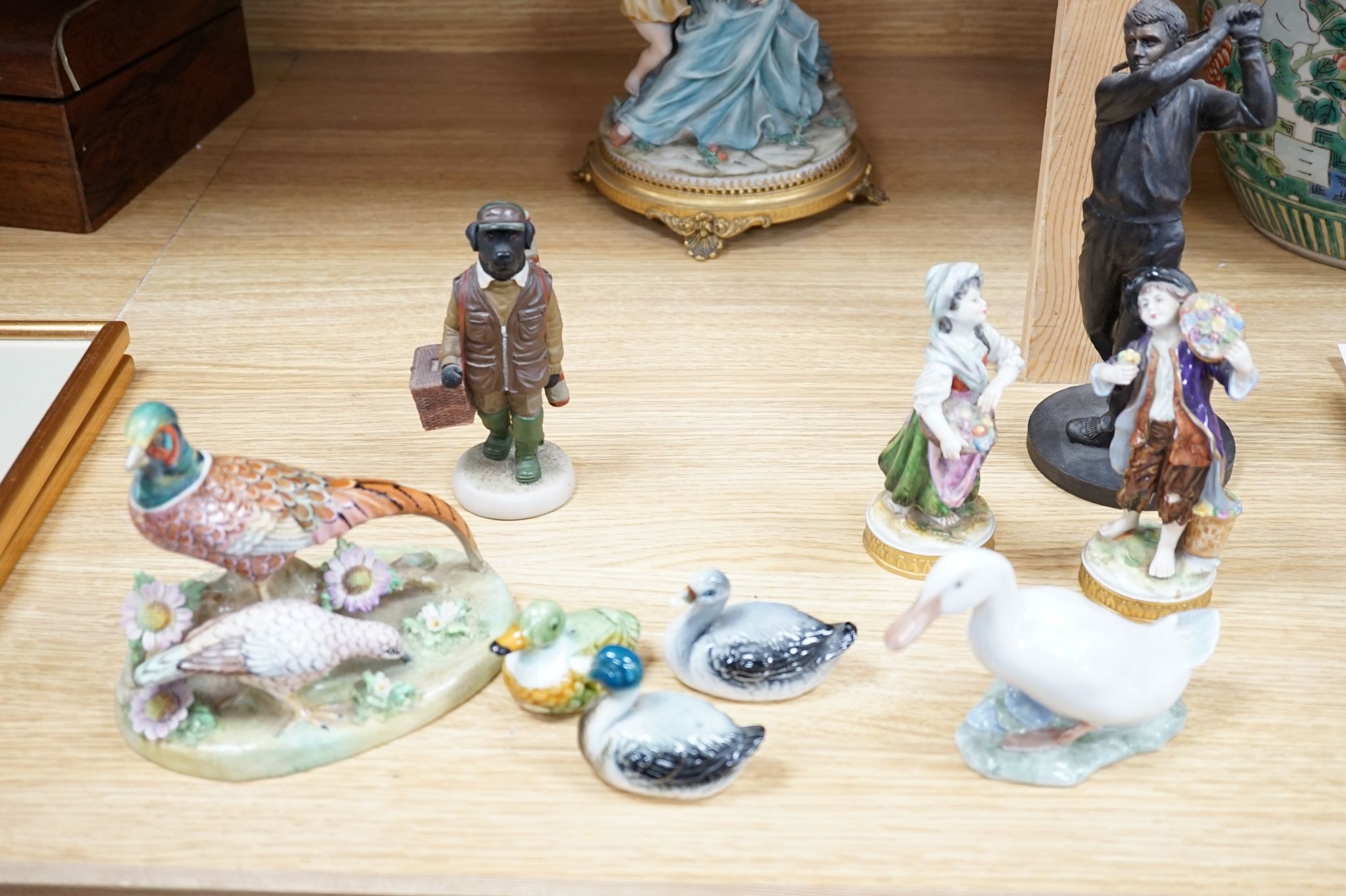 A group of various porcelain figures including Copenhagen, Paragon, Doulton etc., 29cm